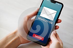 Newsletter subscription button on mobile phone screen. Business marketing concept.