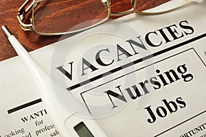 Newspaper with ads nursing jobs vacancy. photo