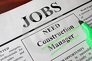 Newspaper with ads for vacancy Construction Manager.