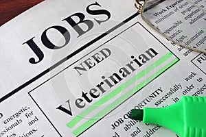 Newspaper with ads for vacancy Veterinarian.