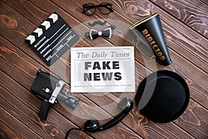 Newspaper on grunge wood background. Fake news