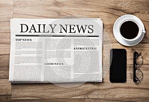 Newspaper with the headline News and glasses and coffee cup on wooden table, Daily Newspaper mock-up concept