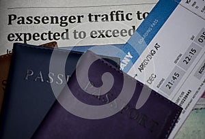 Newspaper headline with passport and ticket concept