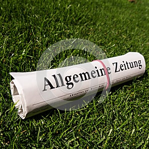 Newspaper on meadow