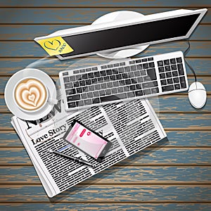 Newspaper and mobile phone with coffee and computer