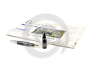 Newspaper and pen