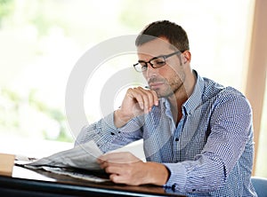 Newspaper, reading and thinking with business man at desk in office for information or media. Company, idea and planning