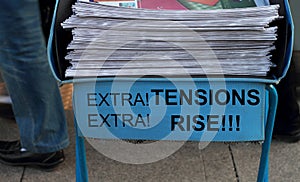 Newspaper stack- Tension Rise headline