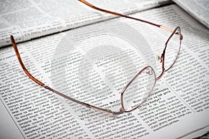 Newspapers and glasses