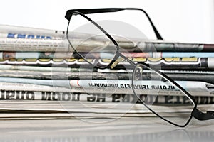Newspapers and glasses photo