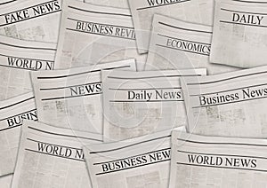 Newspapers with headlines on horizontal surface. Old newspaper background