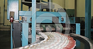 Newspapers, tabloids, print plant factory,magazine transports on conveyor belt line after printing units