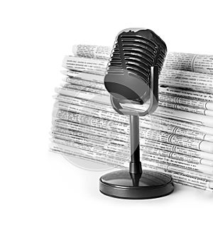 Newspapers and vintage microphone on white. Journalist`s work