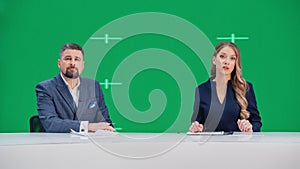 Newsroom TV Studio Live News Program: Caucasian Male and Female Presenters Reporting, Green Screen