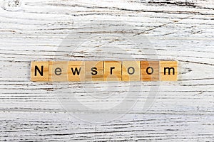 NEWSROOM word made with wooden blocks concept