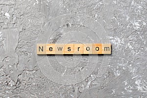 NEWSROOM word made with wooden blocks concept