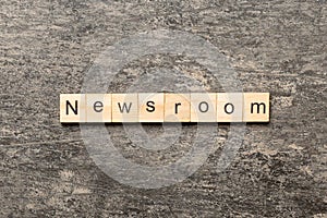 NEWSROOM word made with wooden blocks concept