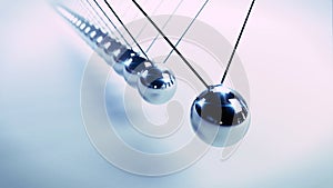 Newton`s cradle, action and reaction concept, series of swinging spheres, device that demonstrates conservation of momentum and e