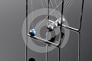 Newtons Cradle balancing balls, business concept in studio