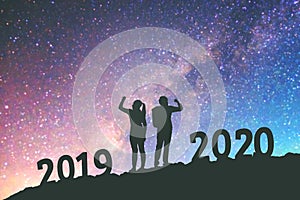 2020 Newyear  Couple celebration success of 2020 Happy new year background on  the Milky Way galaxy