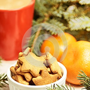 NewYear. Cup of coffee. Delicious tangerines. Spruce branch