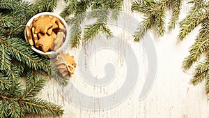 NewYear. Delicious ginger biscuits. Fir branch. Light background