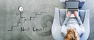Next level concept with man using a laptop photo