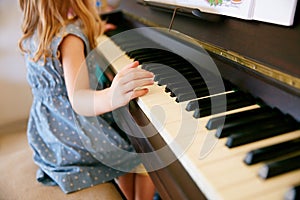 The next Mozart in the making. Cropped shot of a little girl playing the piano.