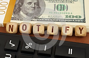 Next to the calculator and dollars are cubes with the inscription - NOTIFY