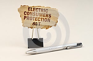 Next to the handle is an office clip with a sign. On the plate is the inscription - Electric Consumers Protection Act