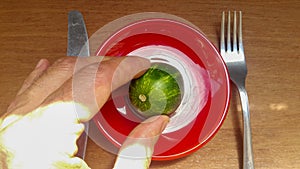 Next to a knife and fork, as if greedy people want to devour planet earth