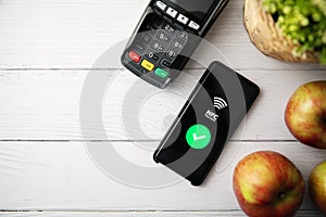 Nfc contactless payment with phone. copy space