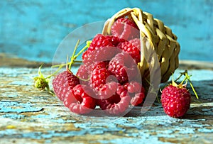 Fresh raspberries in vintage basket vitamins healthy food vegan ingredients. Selective focus