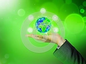 NFT and Digital Art Concept Background with Man TouchingRenewable Energy Concept Background with Globe in a hand.