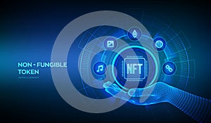 NFT icon in wireframe hand. Non-fungible token digital crypto art blockchain technology concept on virtual screen. Investment in