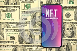 NFT non-fungible cryptographic token logo on the screen of modern mobile phone, purple art, money dollars on the