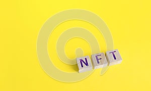 NFT non-fungible token word blocks. Selling digital assets and art through auctions. Monetization, investment in cryptographic