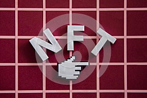 NFT and pixel finger mouse pointer on a red background