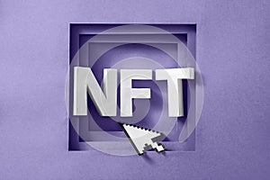 NFT text in a purple frame and a mouse pointer cursor. Minimal concept of virtual innovations and digital art and