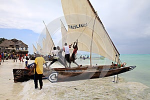 Ngalawa race preparing by raising their sail for competition
