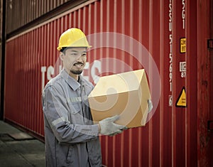 ngineer worker hold cardboard box packaging on product quality