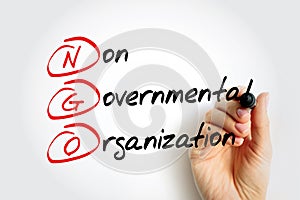 NGO - Non-Governmental Organization is an organization that generally is formed independent from government, acronym text concept photo