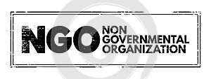 NGO - Non-Governmental Organization is an organization that generally is formed independent from government, acronym text concept