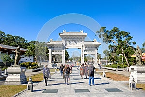 Ngong Ping Entrance gate at Lantau Island, People visit the Tian Tan or the Big Buddha located at Po Lin Monastery, landmark and