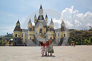 Nha Trang, Viet Nam - May 21,2018:Happy family at the castle in Vinpearland Nha Trang in a summer day