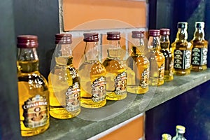 NHA TRANG, VIETNAM - APRIL 17, 2019: A row of small bottles of alcohol on the shelf in store