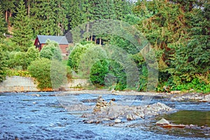 House by the mountain river photo