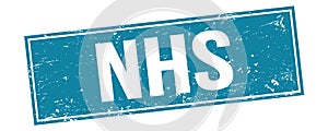 NHS text on blue grungy rectangle stamp