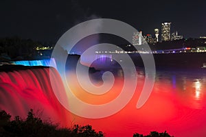 Niagara Falls at night illuminated by lights photo
