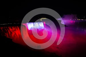 NIagara falls illuminated with color lights at night